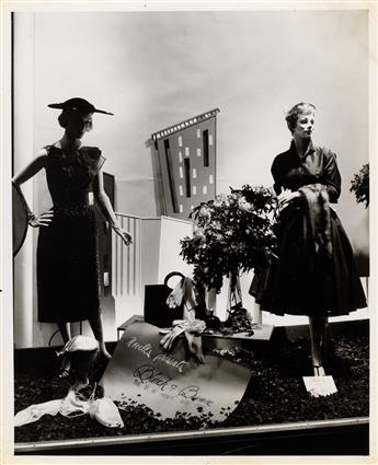 (WINDOW DISPLAYS) Pair of binders with a total of 63 photographs of chic mannequins dressed in seasonal womens wear.